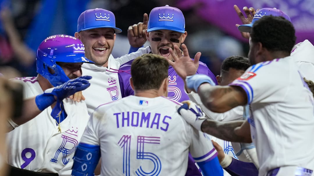 Apr 26, 2026; Kansas City, Missouri, USA; Kansas City Royals center fielder Lane Thomas (15) celebrates with teammates after hitting a walk-off home run during the tenth inning against the Los Angeles Angels at Kauffman Stadium. Mandatory Credit: Jay Biggerstaff-Imagn Images