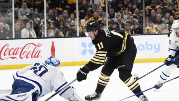 Apr 30, 2024; Boston, Massachusetts, USA; Toronto Maple Leafs goaltender Joseph Woll (60) makes a pad save against Trent Frederic (11) of the Boston Bruins.