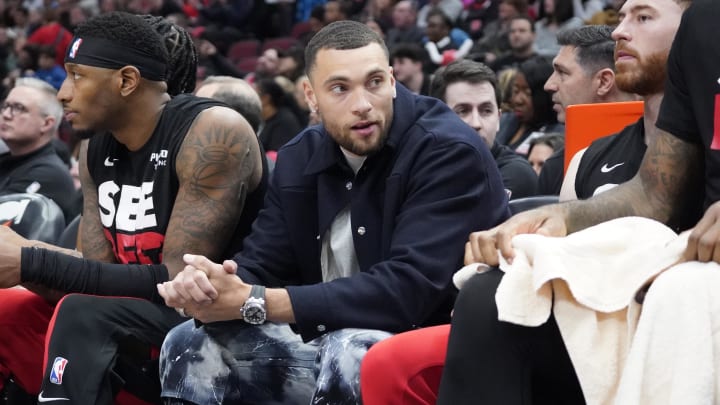 Apr 5, 2024; Chicago, Illinois, USA; Chicago Bulls guard Zach LaVine (8) sits on the bench in street clothes during the first quarter at United Center. Mandatory Credit: David Banks-USA TODAY Sports