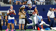 Dallas Cowboys tight end Jake Ferguson runs after a catch during the first quarter against the Detroit Lions at AT&T Stadium.
