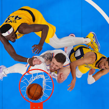 Jun 5, 2025; Oklahoma City, Oklahoma, USA; Oklahoma City Thunder center Isaiah Hartenstein (55) shoots against Indiana Pacers forward Pascal Siakam (43) and guard Tyrese Haliburton (0) during the second half during game one of the 2025 NBA Finals at Paycom Center. Mandatory Credit: Julio Cortez-Pool Photo via Imagn Images