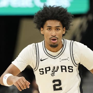 Oct 30, 2025; San Antonio, Texas, USA; San Antonio Spurs guard Dylan Harper (2) gets back on defense during the first half against the Miami Heat at Frost Bank Center. Mandatory Credit: Scott Wachter-Imagn Images