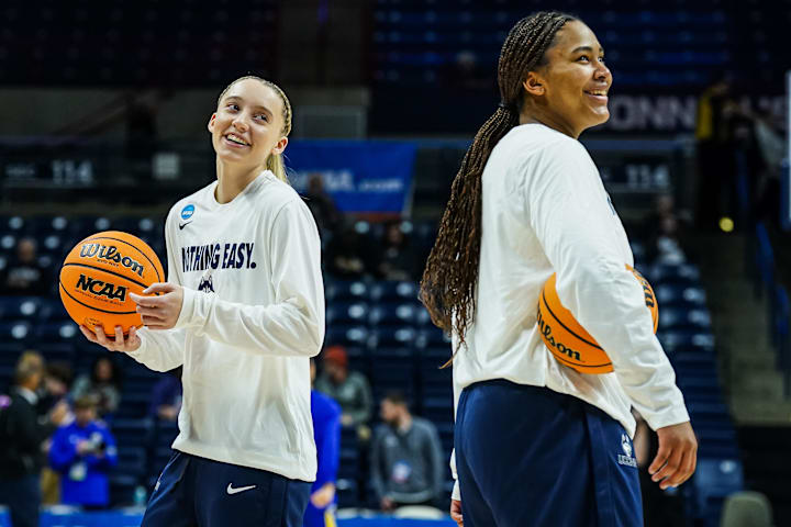 UConn Huskies guard Paige Bueckers and forward Sarah Strong warm up before a game against South Dakota State.