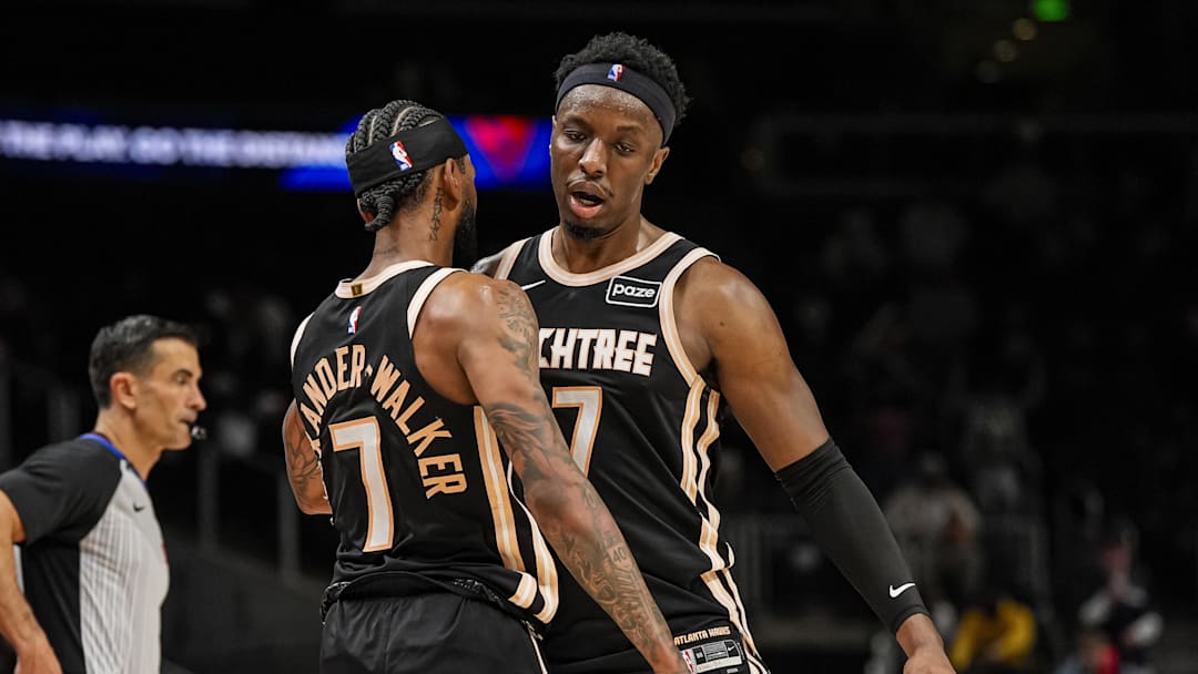Mar 16, 2026; Atlanta, Georgia, USA; Atlanta Hawks guard Nickeil Alexander-Walker (7) and forward Onyeka Okongwu (17) react during the game against the Orlando Magic during the second half at State Farm Arena. Mandatory Credit: Dale Zanine-Imagn Images