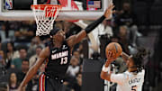 Feb 1, 2025; San Antonio, Texas, USA; San Antonio Spurs guard Stephon Castle (5) shoots over Miami Heat center Bam Adebayo (13) during the second half at Frost Bank Center. Mandatory Credit: Scott Wachter-Imagn Images