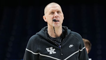 Kentucky Wildcats head coach Mark Pope walks onto the court Thursday, March 27, 2025, during practice ahead of the Sweet 16 March Madness tournament game against the Tennessee Volunteers at Lucas Oil Stadium in Indianapolis.