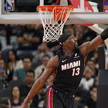 Feb 1, 2025; San Antonio, Texas, USA; San Antonio Spurs guard Stephon Castle (5) shoots over Miami Heat center Bam Adebayo (13) during the second half at Frost Bank Center. Mandatory Credit: Scott Wachter-Imagn Images