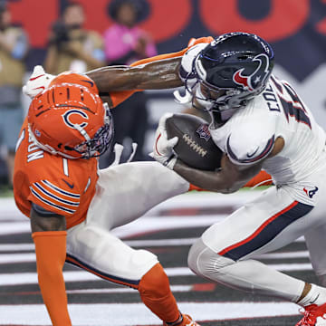 Sep 15, 2024; Houston, Texas, USA;  Houston Texans wide receiver Nico Collins (12) scores a touchdown catch against Chicago Bears cornerback Jaylon Johnson (1) in the second quarter at NRG Stadium. Mandatory Credit: Thomas Shea-Imagn Images