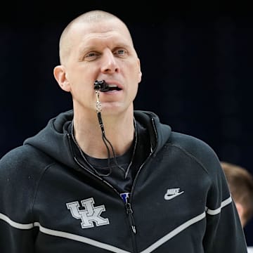 Kentucky Wildcats head coach Mark Pope walks onto the court Thursday, March 27, 2025, during practice ahead of the Sweet 16 March Madness tournament game against the Tennessee Volunteers at Lucas Oil Stadium in Indianapolis.