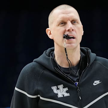Kentucky Wildcats head coach Mark Pope walks onto the court Thursday, March 27, 2025, during practice ahead of the Sweet 16 March Madness tournament game against the Tennessee Volunteers at Lucas Oil Stadium in Indianapolis.
