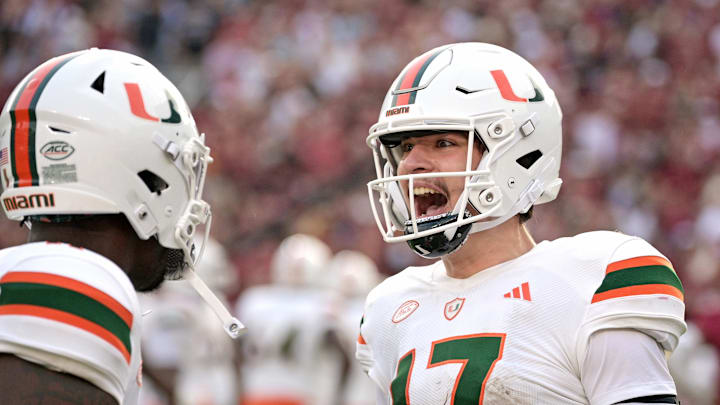 Nov 11, 2023; Tallahassee, Florida, USA; Miami Hurricanes quarterback Emory Williams (17) celebrates a touchdown pass against the Florida State Seminoles during the second half at Doak S. Campbell Stadium. Mandatory Credit: Melina Myers-USA TODAY Sports
