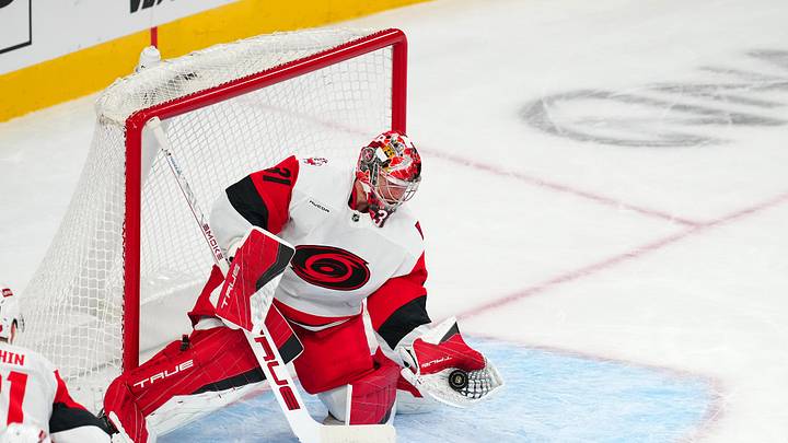 Oct 20, 2025; Las Vegas, Nevada, USA; Carolina Hurricanes goaltender Frederik Anderson (31) makes a glove save against the Vegas Golden Knights during the second period at T-Mobile Arena. Mandatory Credit: Stephen R. Sylvanie-Imagn Images