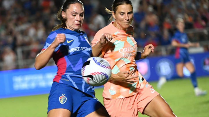 Jun 15, 2024; Cary, North Carolina, USA; North Carolina Courage forward Bianca St-Georges (23) controls the ball with Orlando Pride defender Kylie Strom (3) defending during the second half at WakeMed Soccer Park. Mandatory Credit: Rob Kinnan-Imagn Images