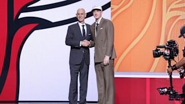 Jun 25, 2025; Brooklyn, NY, USA;  Kasparas Jakucionis stands with NBA commissioner Adam Silver after being selected as the 20th pick by the Miami Heat in the first round of the 2025 NBA Draft at Barclays Center. Mandatory Credit: Brad Penner-Imagn Images