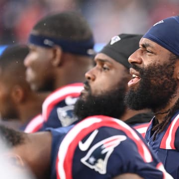 August 8, 2024; Foxborough, MA, USA;  New England Patriots linebacker Matthew Judon (9) on the sideline during the first half against the Carolina Panthers at Gillette Stadium. Mandatory Credit: Eric Canha-USA TODAY Sports