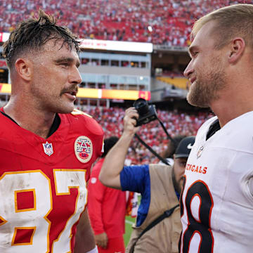 Sep 15, 2024; Kansas City, Missouri, USA; Kansas City Chiefs tight end Travis Kelce (87) talks with Cincinnati Bengals tight end Mike Gesicki (88) after the game at GEHA Field at Arrowhead Stadium. Mandatory Credit: Denny Medley-Imagn Images