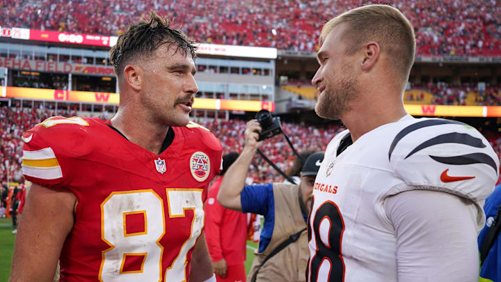 Sep 15, 2024; Kansas City, Missouri, USA; Kansas City Chiefs tight end Travis Kelce (87) talks with Cincinnati Bengals tight end Mike Gesicki (88) after the game at GEHA Field at Arrowhead Stadium. Mandatory Credit: Denny Medley-Imagn Images