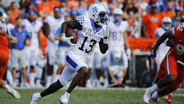 Sep 10, 2016; Gainesville, FL, USA; Kentucky Wildcats wide receiver Jeff Badet (13) runs with he ball against the Florida Gators during the first half at Ben Hill Griffin Stadium. Mandatory Credit: Kim Klement-Imagn Images
