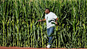 Hall of Fame baseball player and former Cincinnati Reds center fielder Ken Griffey Jr. enters the field through the corn stalks into right field for a pregame catch with his father, Ken Griffey Sr., before a baseball game between the Chicago Cubs and the Cincinnati Reds, Thursday, Aug. 11, 2022, at the MLB Field of Dreams stadium in Dyersville, Iowa.

Mlb Field Of Dreams Game Cincinnati Reds At Chicago Cubs Aug 11 1283