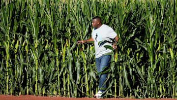 Hall of Fame baseball player and former Cincinnati Reds center fielder Ken Griffey Jr. enters the field through the corn stalks into right field for a pregame catch with his father, Ken Griffey Sr., before a baseball game between the Chicago Cubs and the Cincinnati Reds, Thursday, Aug. 11, 2022, at the MLB Field of Dreams stadium in Dyersville, Iowa.

Mlb Field Of Dreams Game Cincinnati Reds At Chicago Cubs Aug 11 1283