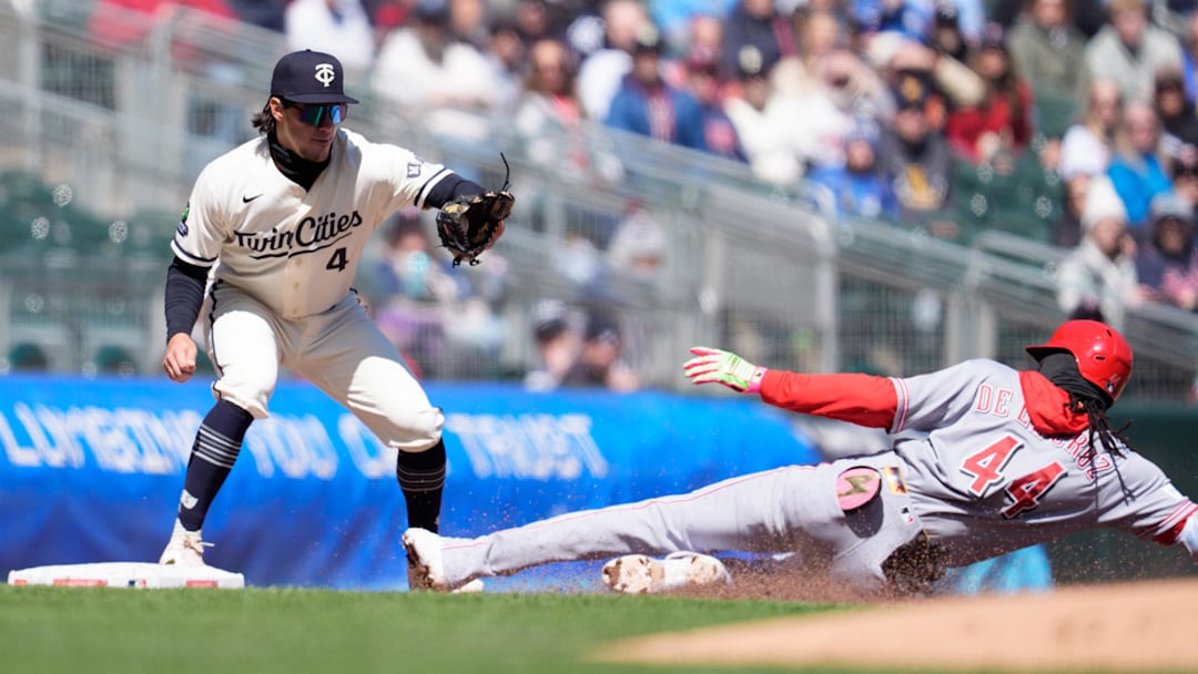 Apr 19, 2026; Minneapolis, Minnesota, USA; Cincinnati Reds shortstop Elly de la Cruz (44) slides into third base, beating the throw to Minnesota Twins third baseman Tristan Gray (4) in the fourth inning at Target Field. Mandatory Credit: Matt Blewett-Imagn Images