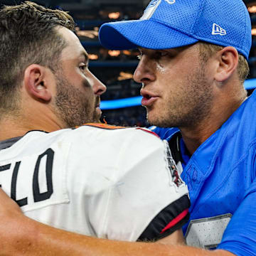 Tampa Bay Buccaneers quarterback Baker Mayfield (6) hugs Detroit Lions quarterback Jared Goff (16) 