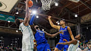 Jan 30, 2025; New Orleans, Louisiana, USA;  Tulane Green Wave forward Kaleb Banks (1) secures a rebound against Memphis Tigers center Moussa Cisse (32) during the first half at Avron B. Fogelman Arena in Devlin Fieldhouse.