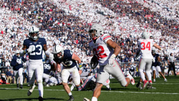 Oct 29, 2022; University Park, Pennsylvania, USA; Ohio State Buckeyes running back TreVeyon Henderson (32) runs for a 7-yard touchdown past Penn State Nittany Lions linebacker Tyler Elsdon (43) and linebacker Curtis Jacobs (23) during the fourth quarter of the NCAA Division I football game at Beaver Stadium. Mandatory Credit: Adam Cairns-The Columbus Dispatch

Ncaa Football Ohio State Buckeyes At Penn State Nittany Lions

Syndication The Columbus Dispatch