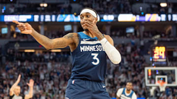 Apr 27, 2025; Minneapolis, Minnesota, USA; Minnesota Timberwolves forward Jaden McDaniels (3) celebrates a three pointer made against the Los Angeles Lakers in the third quarter during game four of first round for the 2025 NBA Playoffs at Target Center. Mandatory Credit: Matt Blewett-Imagn Images
