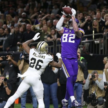 Minnesota Vikings tight end Kyle Rudolph (82) catches a pass for the winning touchdown over New Orleans Saints cornerback P.J. Williams (26) during overtime of a NFC Wild Card playoff game at the Mercedes-Benz Superdome in New Orleans on Jan. 5, 2020.