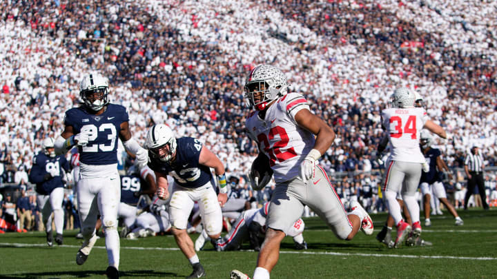 Oct 29, 2022; University Park, Pennsylvania, USA; Ohio State Buckeyes running back TreVeyon Henderson (32) runs for a 7-yard touchdown past Penn State Nittany Lions linebacker Tyler Elsdon (43) and linebacker Curtis Jacobs (23) during the fourth quarter of the NCAA Division I football game at Beaver Stadium. Mandatory Credit: Adam Cairns-The Columbus Dispatch

Ncaa Football Ohio State Buckeyes At Penn State Nittany Lions

Syndication The Columbus Dispatch