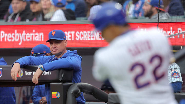Apr 30, 2026; New York City, New York, USA; New York Mets manager Carlos Mendoza (64) watches as designated hitter Juan Soto (22) swings in the on-deck circle during the third inning against the Washington Nationals at Citi Field. Mandatory Credit: Brad Penner-Imagn Images