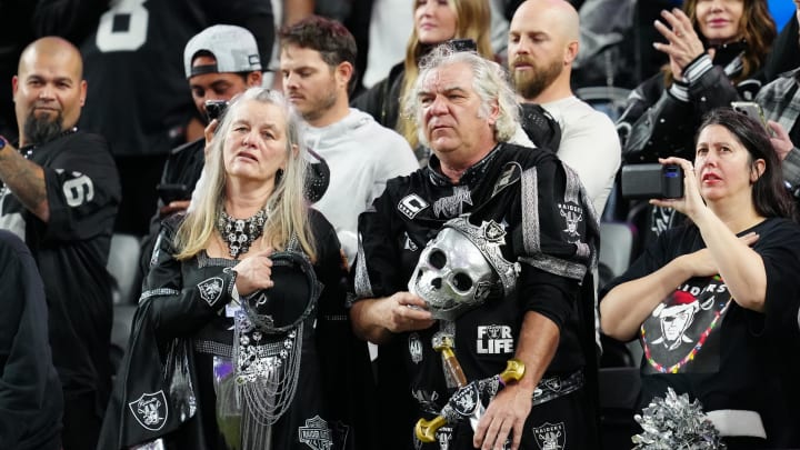 Dec 14, 2023; Paradise, Nevada, USA; Las Vegas Raiders fans listen to the national anthem before the game against the Los Angeles Chargers  at Allegiant Stadium. Mandatory Credit: Stephen R. Sylvanie-USA TODAY Sports