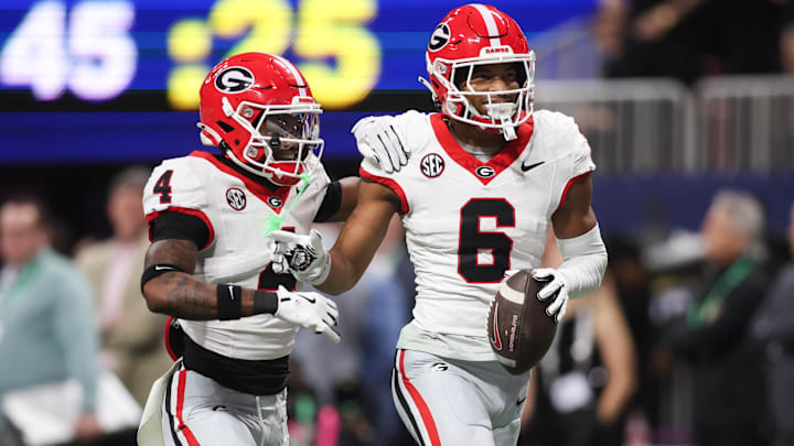 Dec 6, 2025; Atlanta, GA, USA; Georgia Bulldogs defensive back Daylen Everette (6) celebrates an interception with Georgia Bulldogs defensive back Kj Bolden (4) during the second quarter during the 2025 SEC Championship game at Mercedes-Benz Stadium. Mandatory Credit: Brett Davis-Imagn Images