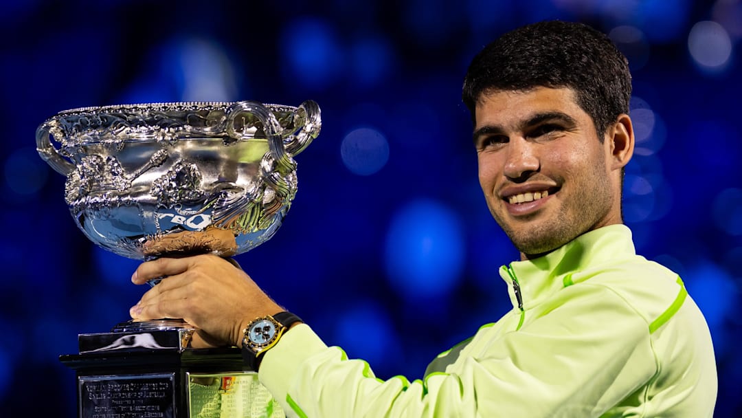Carlos Alcaraz smiles at the Australian Open