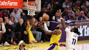 Apr 22, 2025; Los Angeles, California, USA; Los Angeles Lakers forward LeBron James (23) goes to the basket against Minnesota Timberwolves center Naz Reid (11) during the fourth quarter of game two of first round for the 2024 NBA Playoffs at Crypto.com Arena. Mandatory Credit: Kiyoshi Mio-Imagn Images