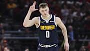 Mar 23, 2025; Houston, Texas, USA; Denver Nuggets guard Christian Braun (0) reacts after making a basket during the second quarter against the Houston Rockets at Toyota Center. Mandatory Credit: Troy Taormina-Imagn Images