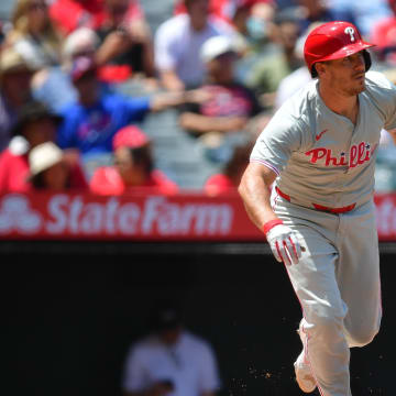 May 1, 2024; Anaheim, California, USA; Philadelphia Phillies catcher J.T. Realmuto (10) hits a single against the Los Angeles Angels during the second inning at Angel Stadium.