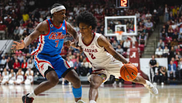 Jan 14, 2025; Tuscaloosa, Alabama, USA; Alabama Crimson Tide guard Aden Holloway (2) works against Mississippi Rebels guard Davon Barnes (7) during the second half at Coleman Coliseum. Mandatory Credit: Will McLelland-Imagn Images