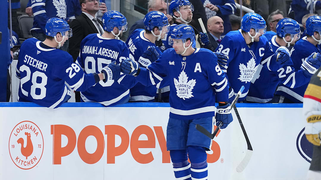 Jan 23, 2026; Toronto, Ontario, CAN; Toronto Maple Leafs center John Tavares (91) celebrates at the bench after scoring a goal against the Vegas Golden Knights during the second period at Scotiabank Arena. Mandatory Credit: Nick Turchiaro-Imagn Images
