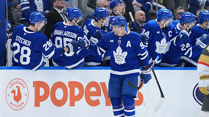 Jan 23, 2026; Toronto, Ontario, CAN; Toronto Maple Leafs center John Tavares (91) celebrates at the bench after scoring a goal against the Vegas Golden Knights during the second period at Scotiabank Arena. Mandatory Credit: Nick Turchiaro-Imagn Images