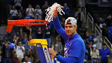 Mar 29, 2025; Newark, NJ, USA; Duke Blue Devils head coach Jon Scheyer cuts down the net after the Duke Blue Devils beat the Alabama Crimson Tide in the East Regional final of the 2025 NCAA tournament at Prudential Center. Mandatory Credit: Robert Deutsch-Imagn Images