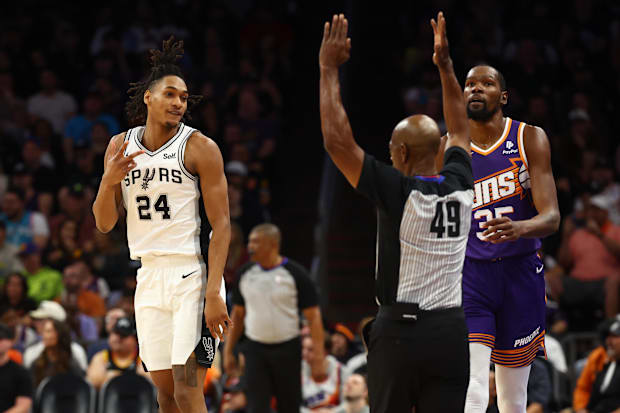 San Antonio Spurs guard Devin Vassell (24) celebrates a three point shot against Phoenix Suns forward Kevin Durant (35) in th