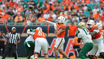 Sep 13, 2025; Miami Gardens, Florida, USA; Miami Hurricanes quarterback Carson Beck (11) passes the football against the South Florida Bulls during the first quarter at Hard Rock Stadium. Mandatory Credit: Sam Navarro-Imagn Images