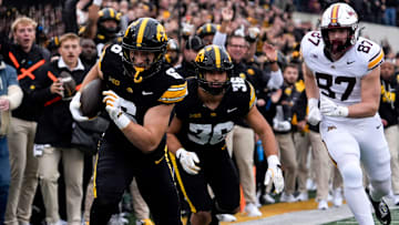 Iowa Hawkeyes defensive back Zach Lutmer (6) returns an interception for a touchdown against the Minnesota Golden Gophers Oct. 25, 2025 at Kinnick Stadium in Iowa City, Iowa.