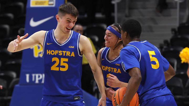 Dec 7, 2025; Pittsburgh, Pennsylvania, USA; Hofstra Pride guard German Plotnikov (25) and guard Preston Edmead (middle) and guard Cruz Davis (5) celebrate after defeating the Pittsburgh Panthers at the Petersen Events Center. Mandatory Credit: Charles LeClaire-Imagn Images