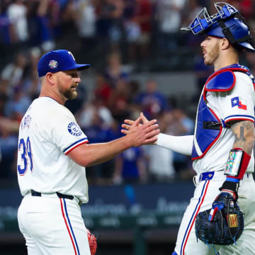 Jun 19, 2024; Arlington, Texas, USA; Texas Rangers relief pitcher Kirby Yates (39) celebrates with Texas Rangers catcher Jonah Heim (28) after the game against the New York Mets at Globe Life Field.