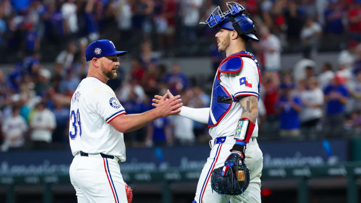 Jun 19, 2024; Arlington, Texas, USA; Texas Rangers relief pitcher Kirby Yates (39) celebrates with Texas Rangers catcher Jonah Heim (28) after the game against the New York Mets at Globe Life Field.