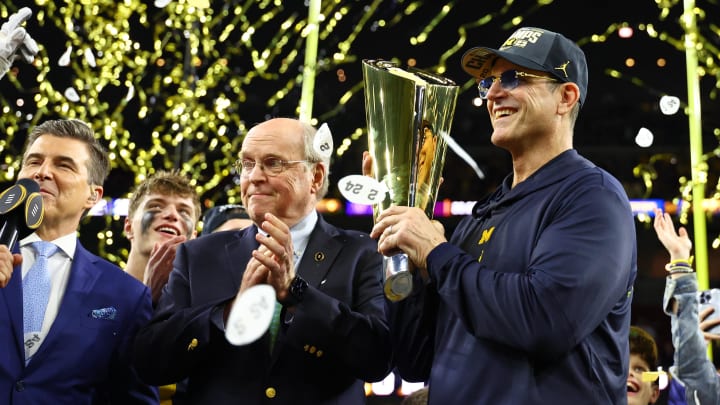 Jan 8, 2024; Houston, TX, USA; Michigan Wolverines head coach Jim Harbaugh holds the National Championship Trophy as he celebrates after winning 2024 College Football Playoff national championship game against the Washington Huskies at NRG Stadium. Mandatory Credit: Mark J. Rebilas-USA TODAY Sports