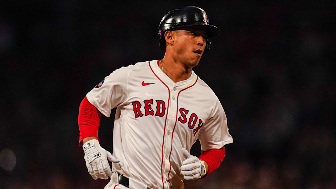 Sep 9, 2024; Boston, Massachusetts, USA; Boston Red Sox right fielder Rob Refsnyder (30) hits a two run home run against the Baltimore Orioles in the third inning at Fenway Park. Mandatory Credit: David Butler II-Imagn Images
